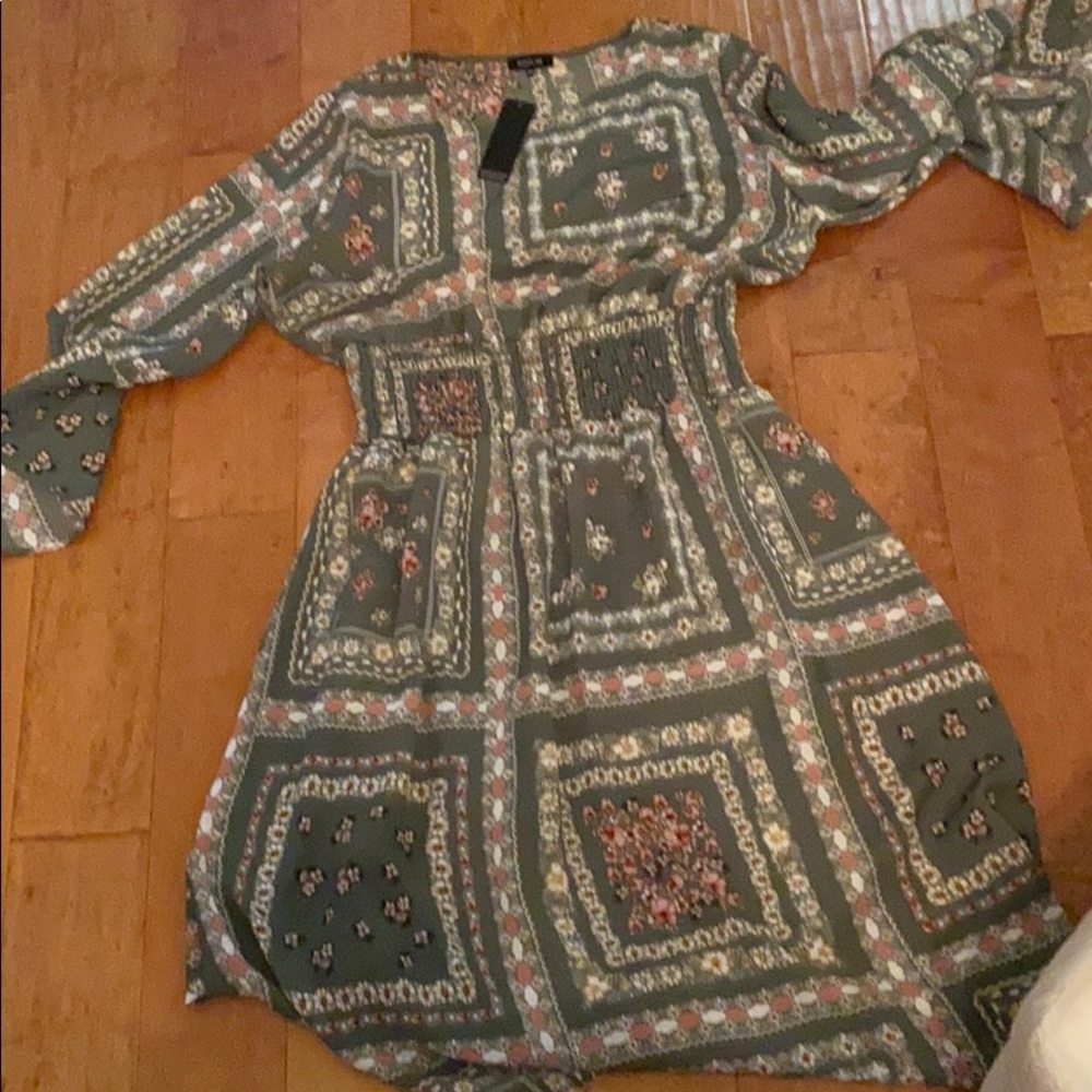 Never been worn Roolee Spring dress with tags.